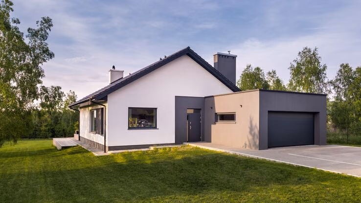 Abgebildet ist ein kleines neues Haus als Immobilie im Alter.